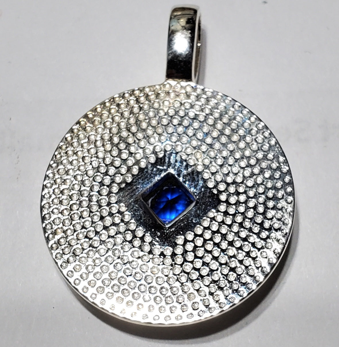 ssj010- NA Medallion w/ Blue Gem Pendant