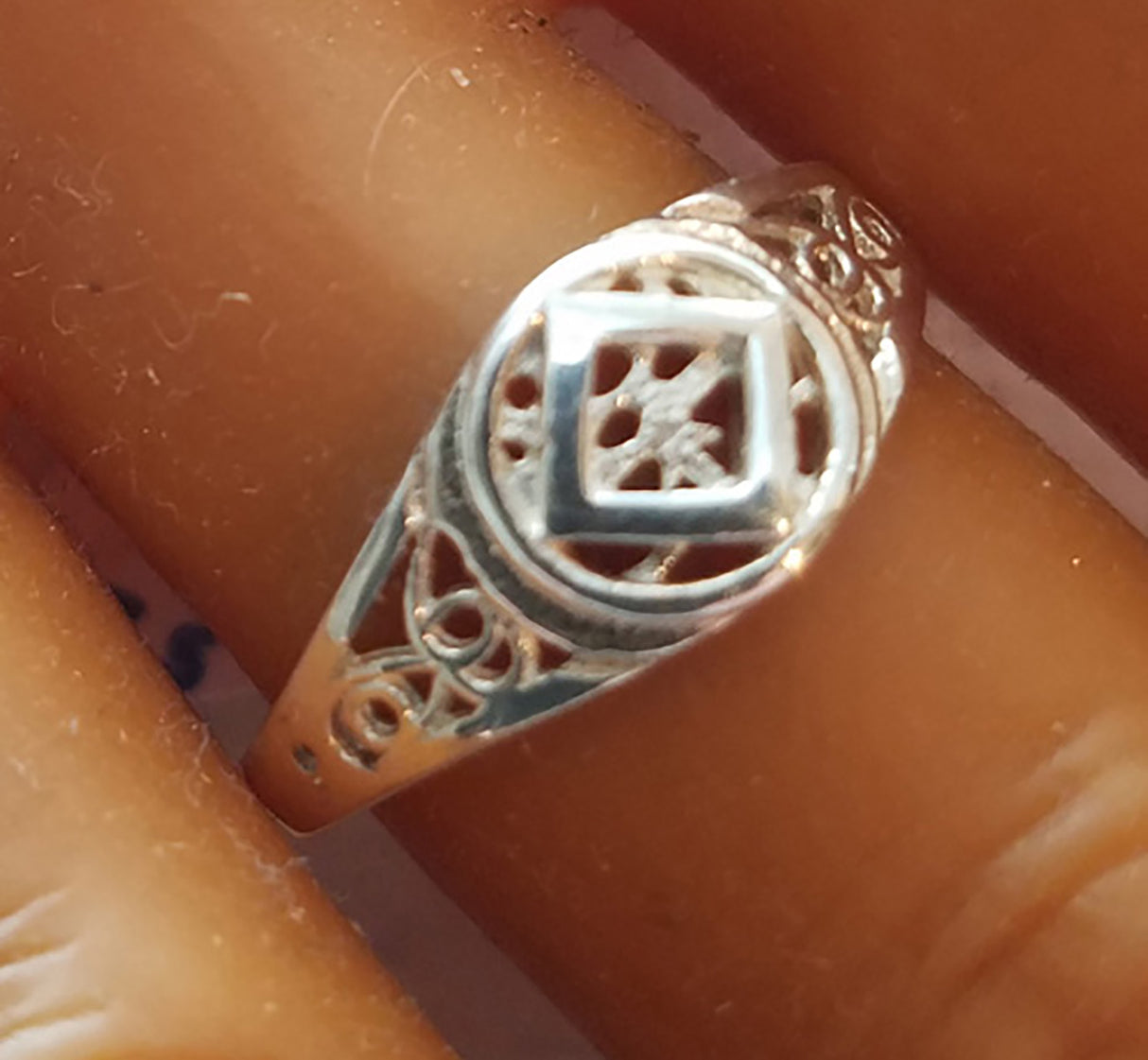 SMALL PIERCED NA SYMBOL RING - nawears