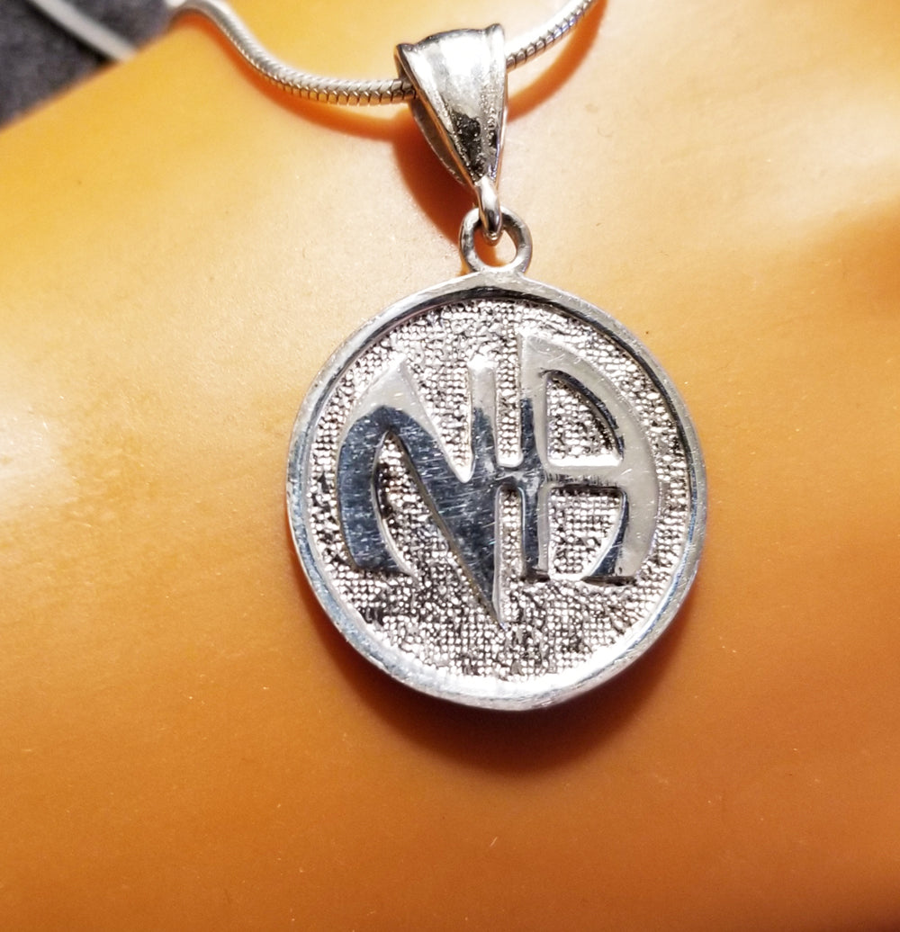 ssj003- Nickel Size NA Symbol Pendant
