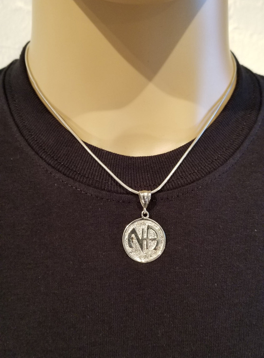 ssj003- Nickel Size NA Symbol Pendant