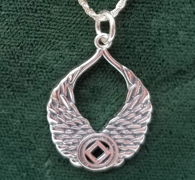 Silver WINGS WITH NA SYMBOL PENDANT - nawears