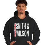 Person wearing a black hoodie with 'Smith & Wilson' text on a white background