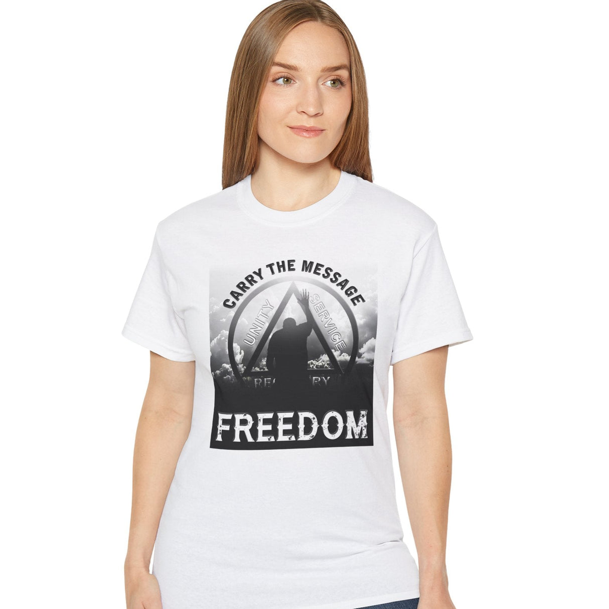 Woman wearing a white t-shirt with 'Carry the Message Freedom' design on a white background