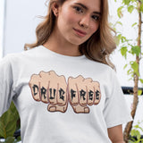 Person wearing a white t-shirt with 'DRUG FREE' design outdoors.