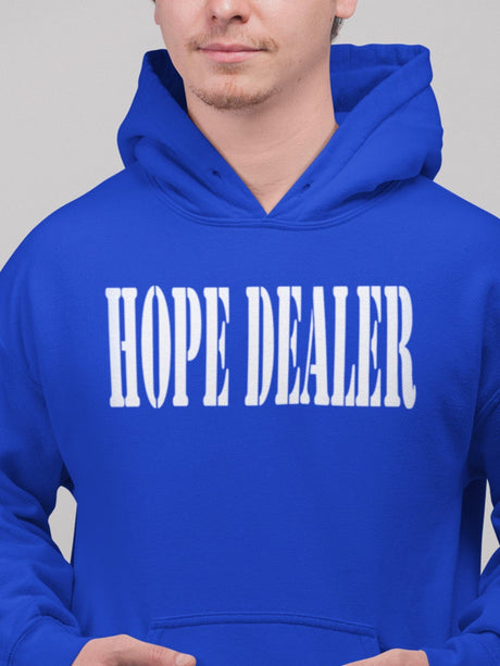 Person wearing a blue hoodie with 'HOPE DEALER' text on a gray background