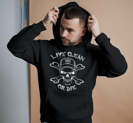 Man wearing a black hoodie with a graphic design and text.