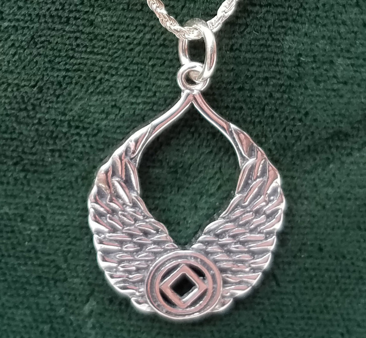 Silver WINGS WITH NA SYMBOL PENDANT - nawears