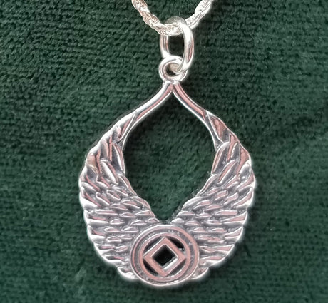 Silver WINGS WITH NA SYMBOL PENDANT - nawears